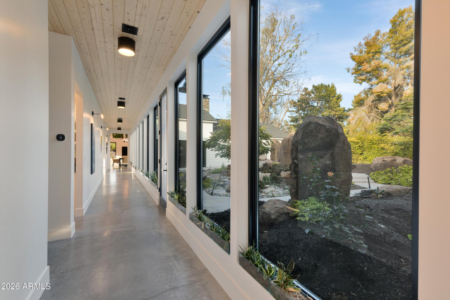 long hallway with windows 