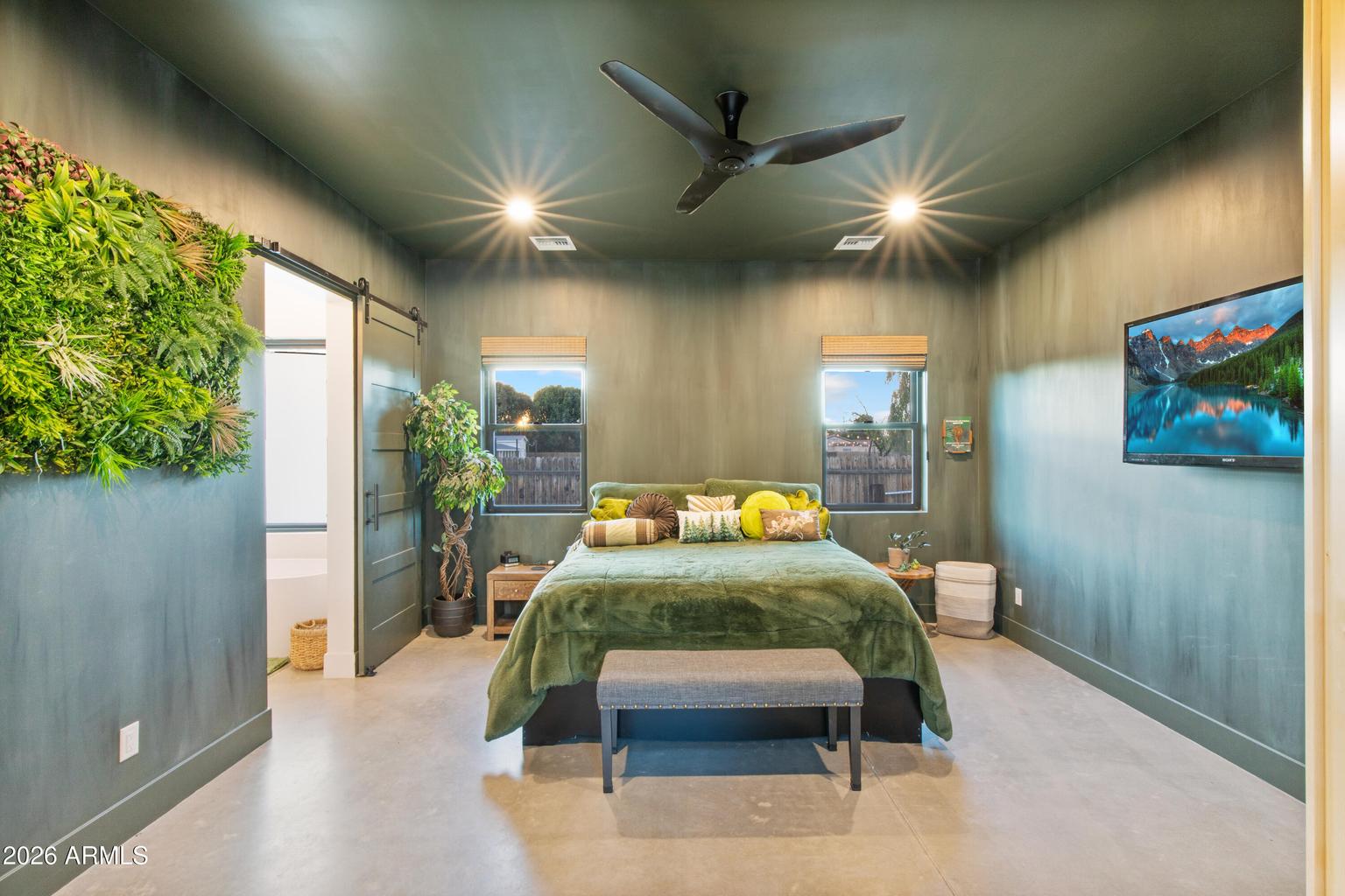 bedroom with green walls and bed 