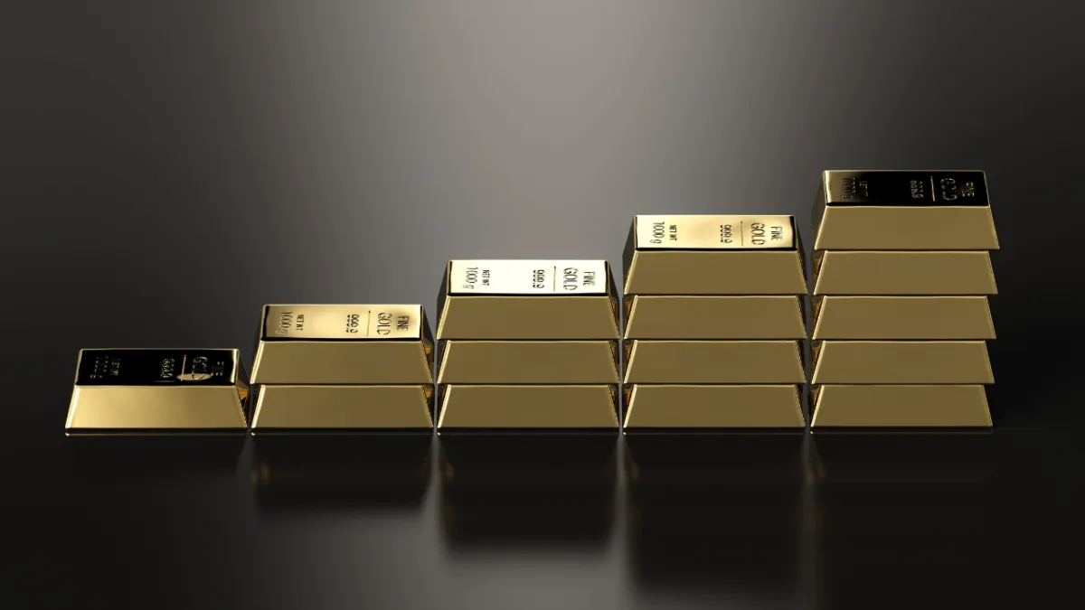 a pile of gold bars sitting on top of a table