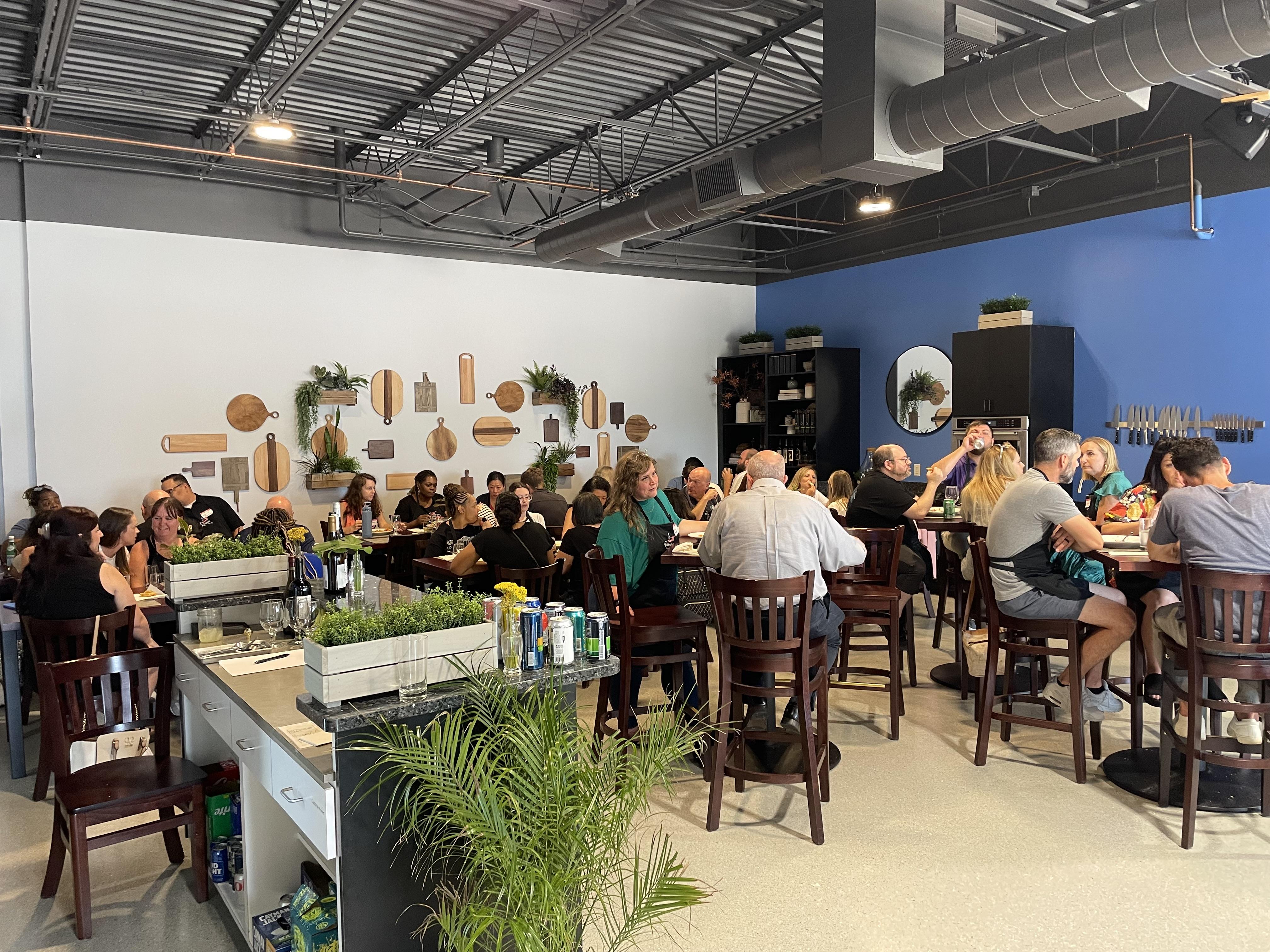 Corporate team-building event with interactive cooking activities and private dining experience at The Learning Kitchen