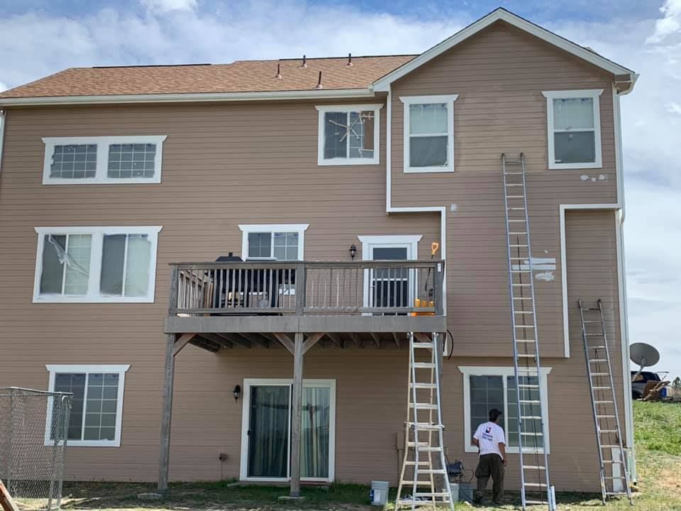 A house being pressure washed.