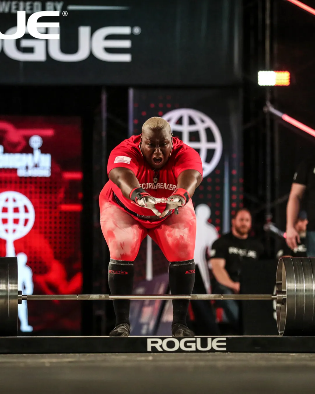 A heavy barbell loaded with plates, representing strength and discipline in a premium gym setting.
