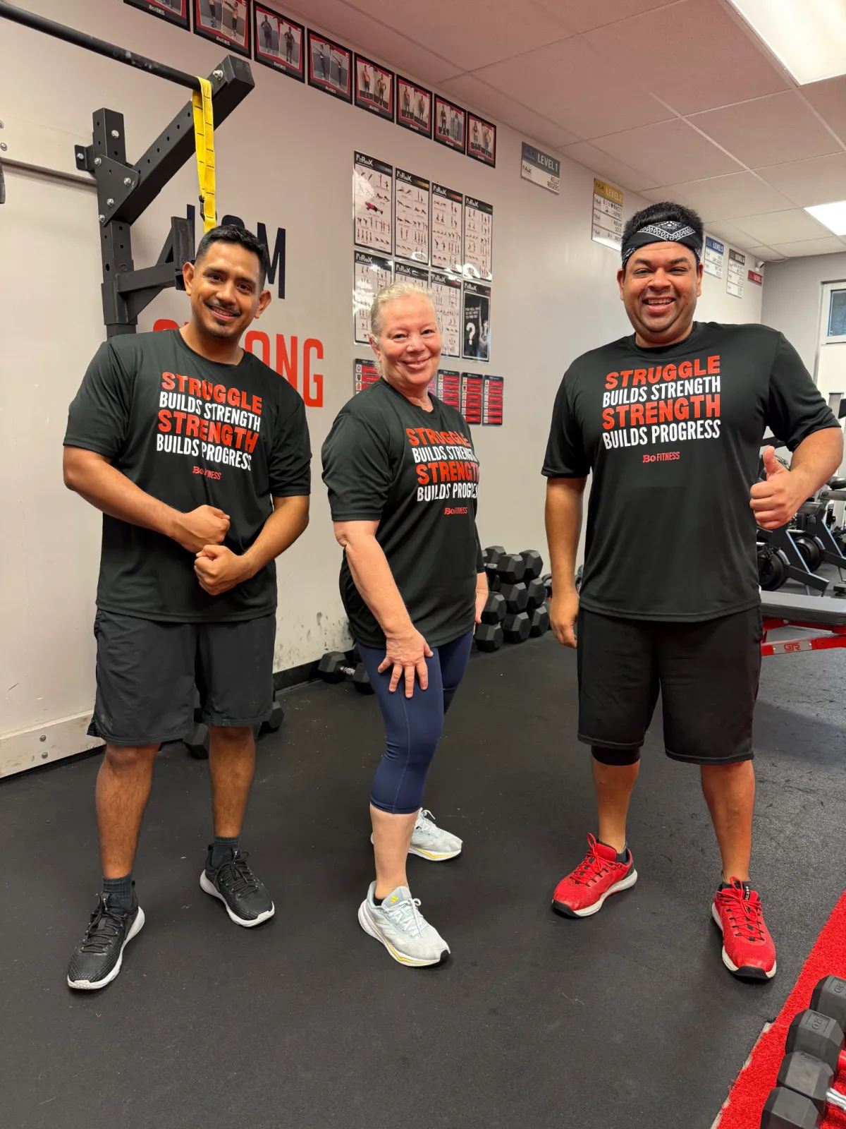 Members cheering and supporting each other during a workout