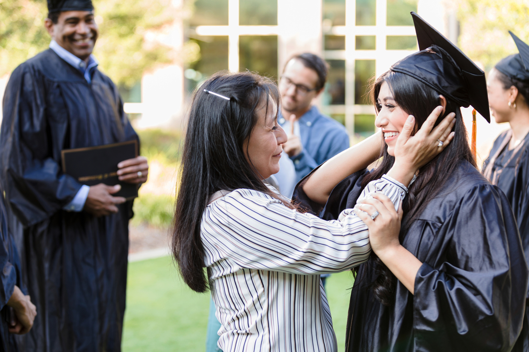 parents celebrating child's graduation success