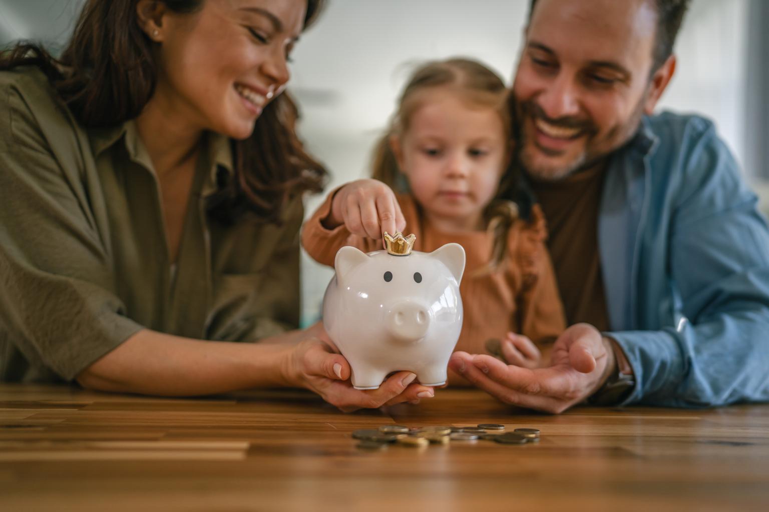 grandparents teaching grandchild saving money