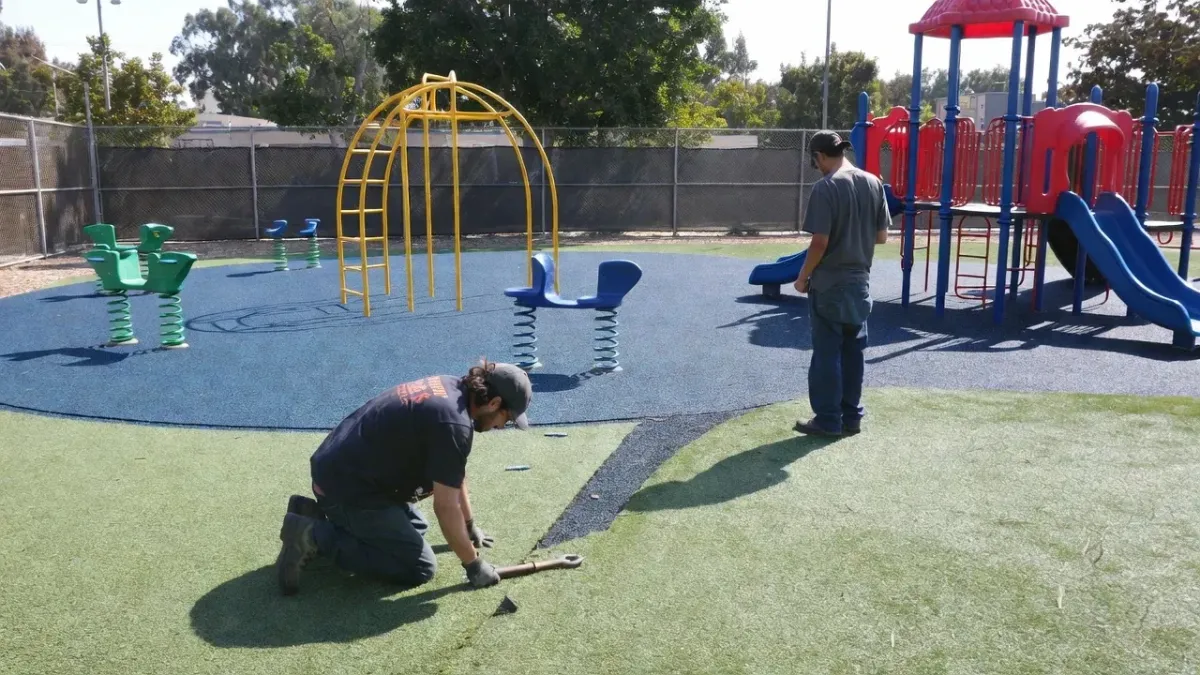 Playground turf installation in Petaluma CA with synthetic safety surfacing and play equipment