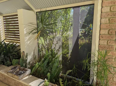 Damaged outdoor blind being repaired by a specialist