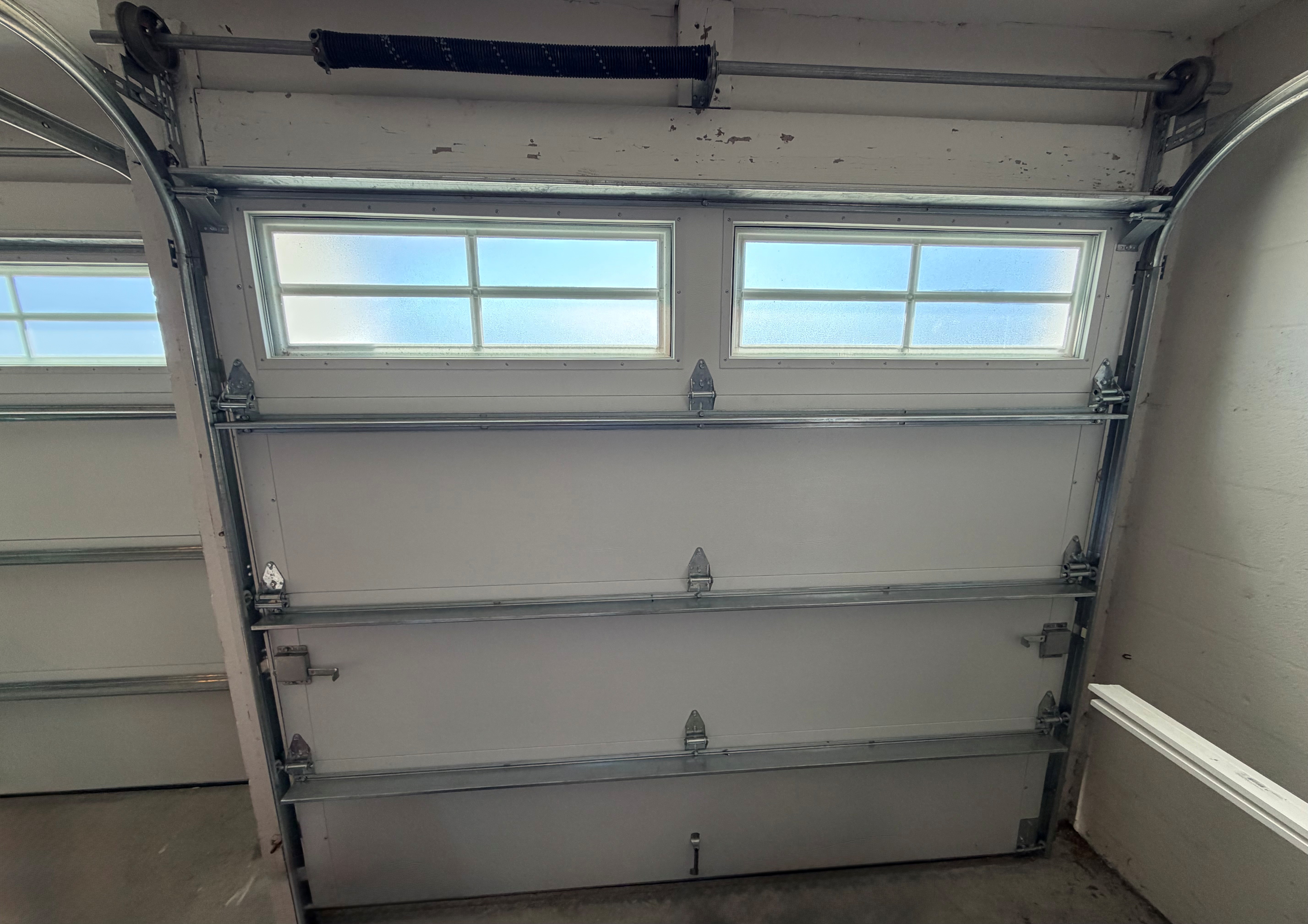 a close up of a wooden fence with screws