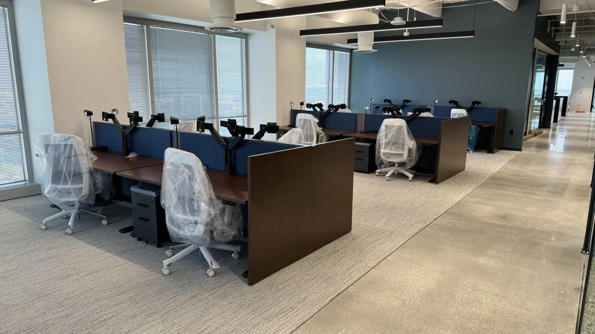 Project manager coordinating operations on a commercial installation job site