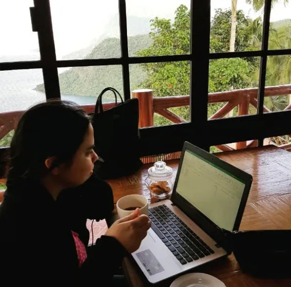 Modern and organized editorial workspace with notebook, laptop, and coffee representing The Write VA services