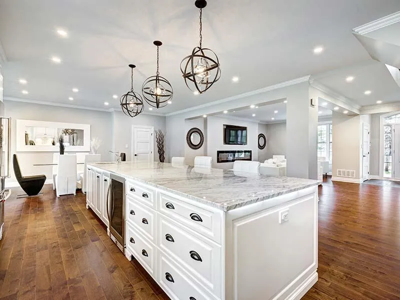 a white kitchen with woodworks