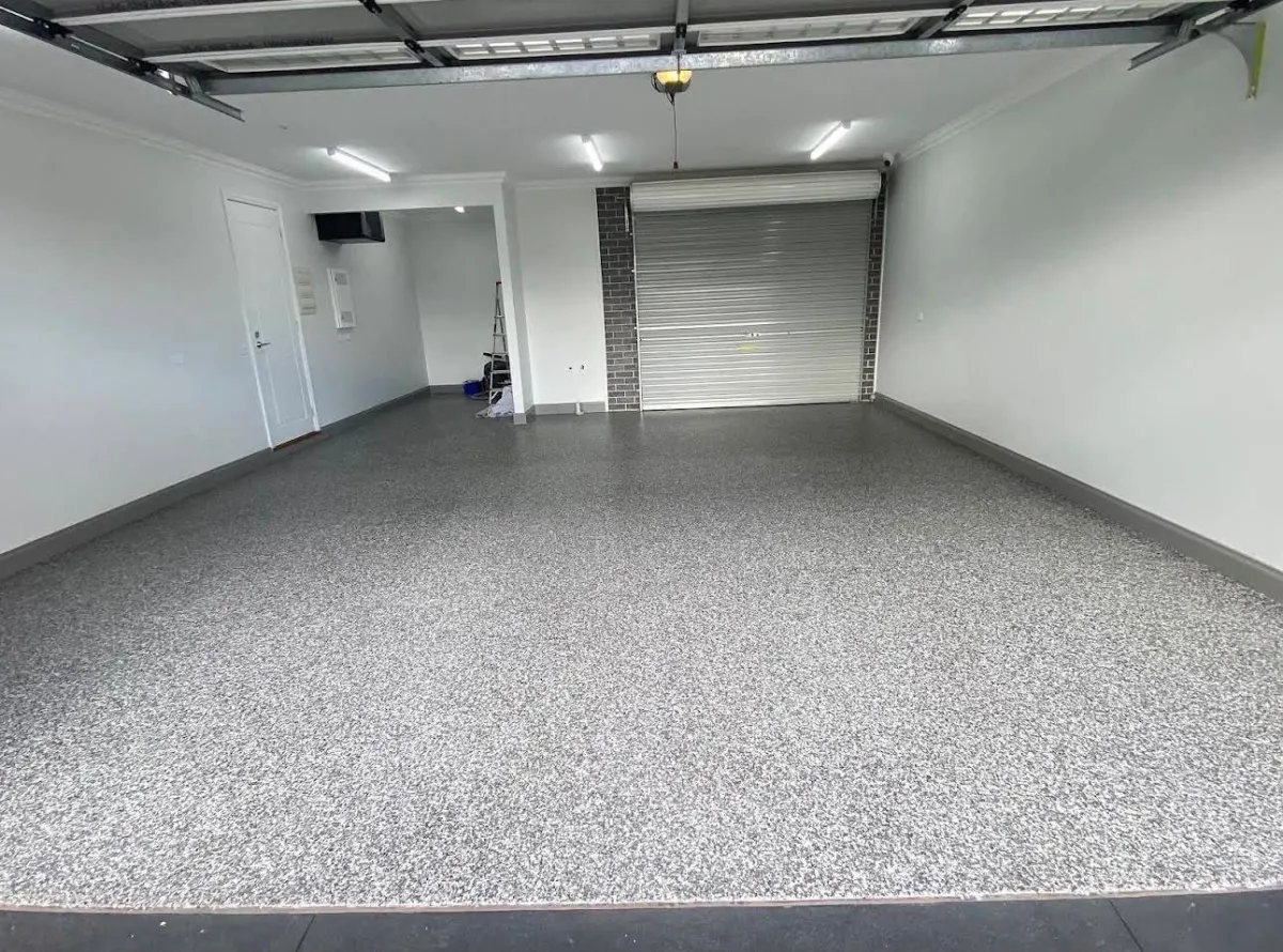 full garage view of a black and white flake epoxy flooring