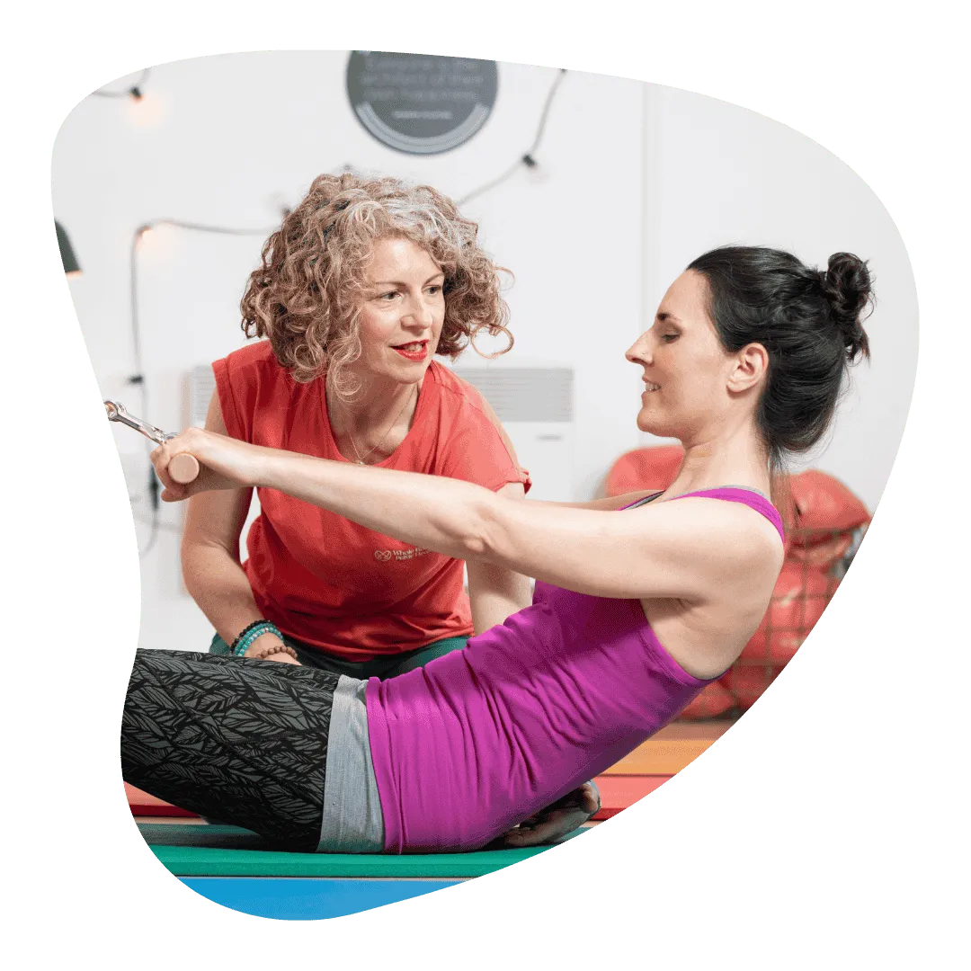 Claire teaching a lady exercises for pelvic floor