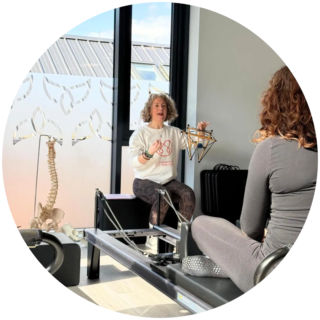 Claire teaching people about pelvic floors