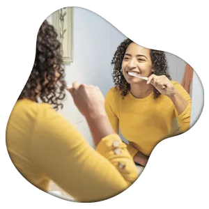 woman brushing her teeth