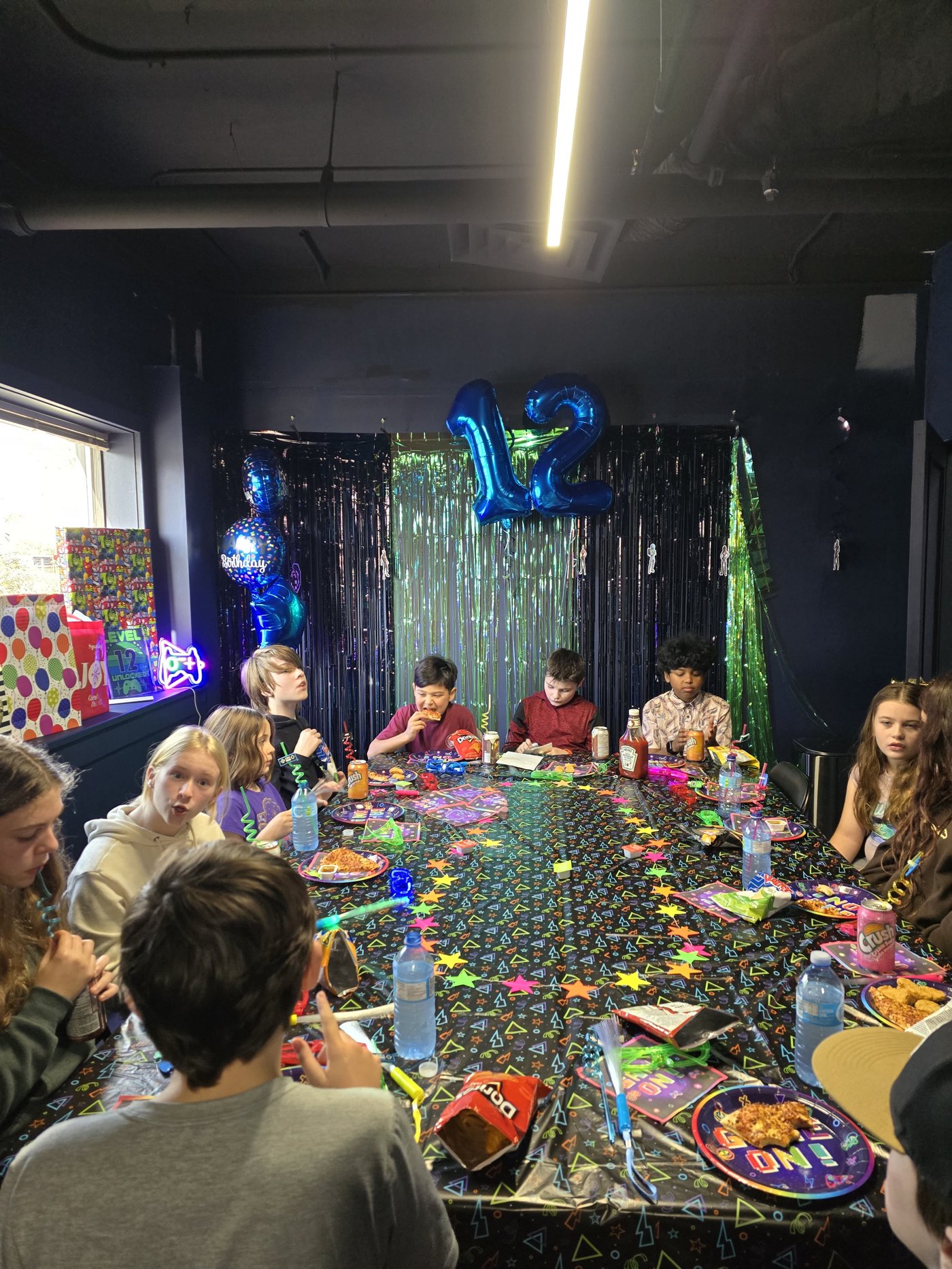 Birthday party lounge with pizza and friends