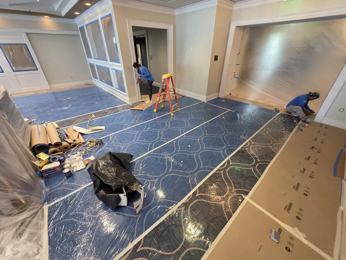 Crew prepping the Pelican Isles Yacht Club dining room for interior painting