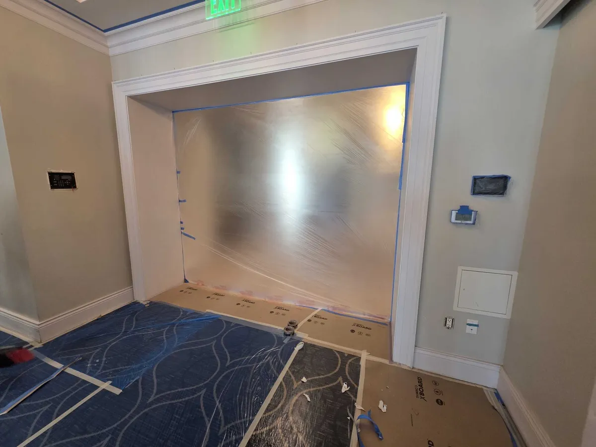 Clubhouse entry with floors protected during interior painting at Pelican Isles Yacht Club