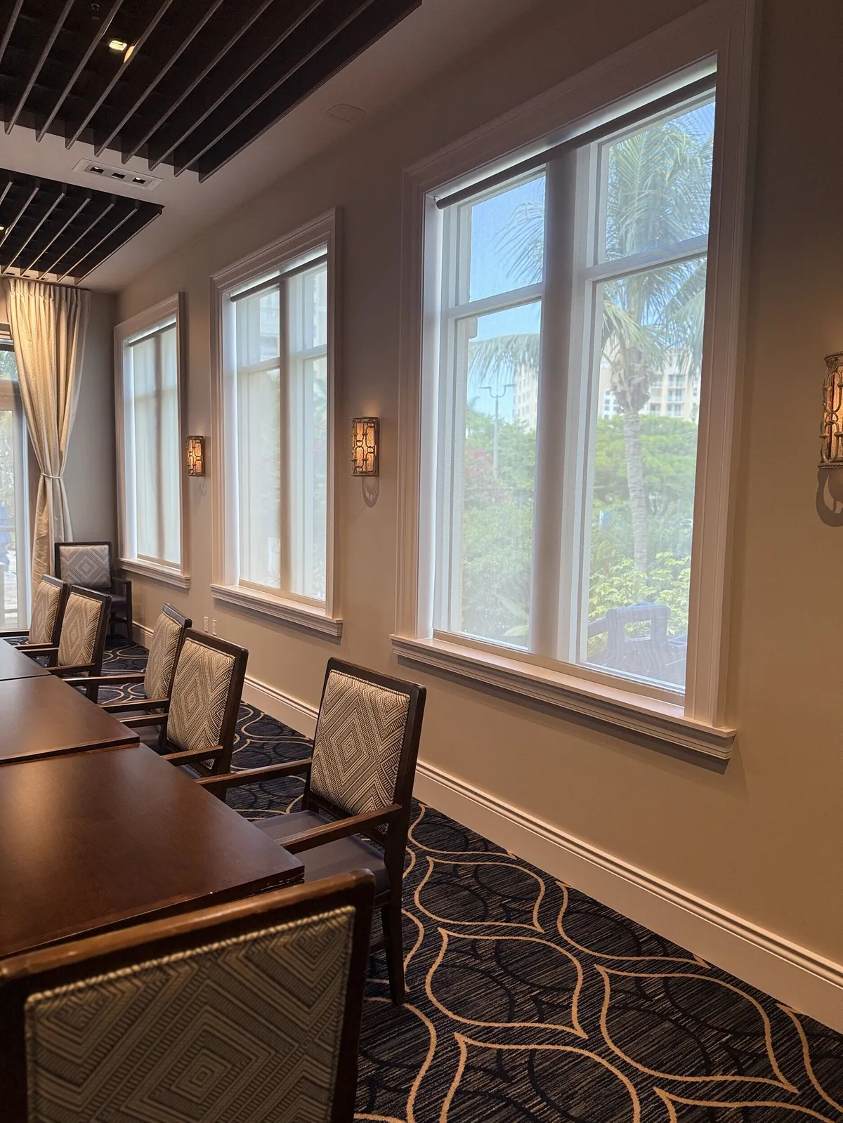 Repainted walls and window trim in a Pelican Isles Yacht Club dining room