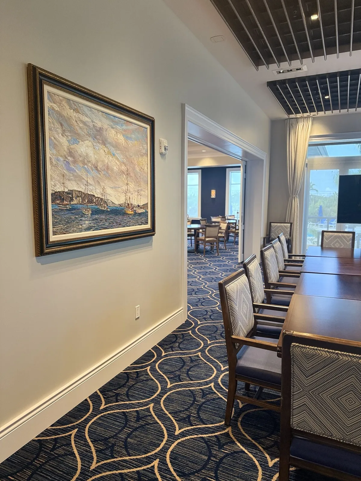 Freshly painted dining room wall with artwork at Pelican Isles Yacht Club