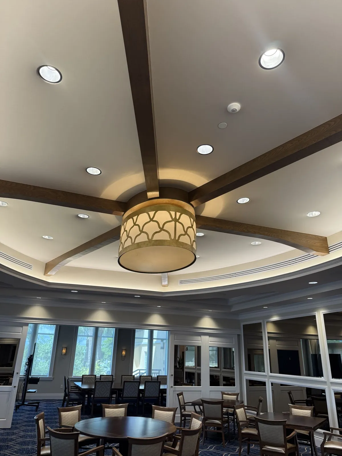 Repainted ceiling beams and chandelier over the Pelican Isles Yacht Club dining room