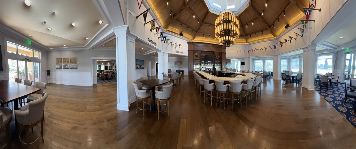 Wide view of the repainted bar and dining area at Pelican Isles Yacht Club