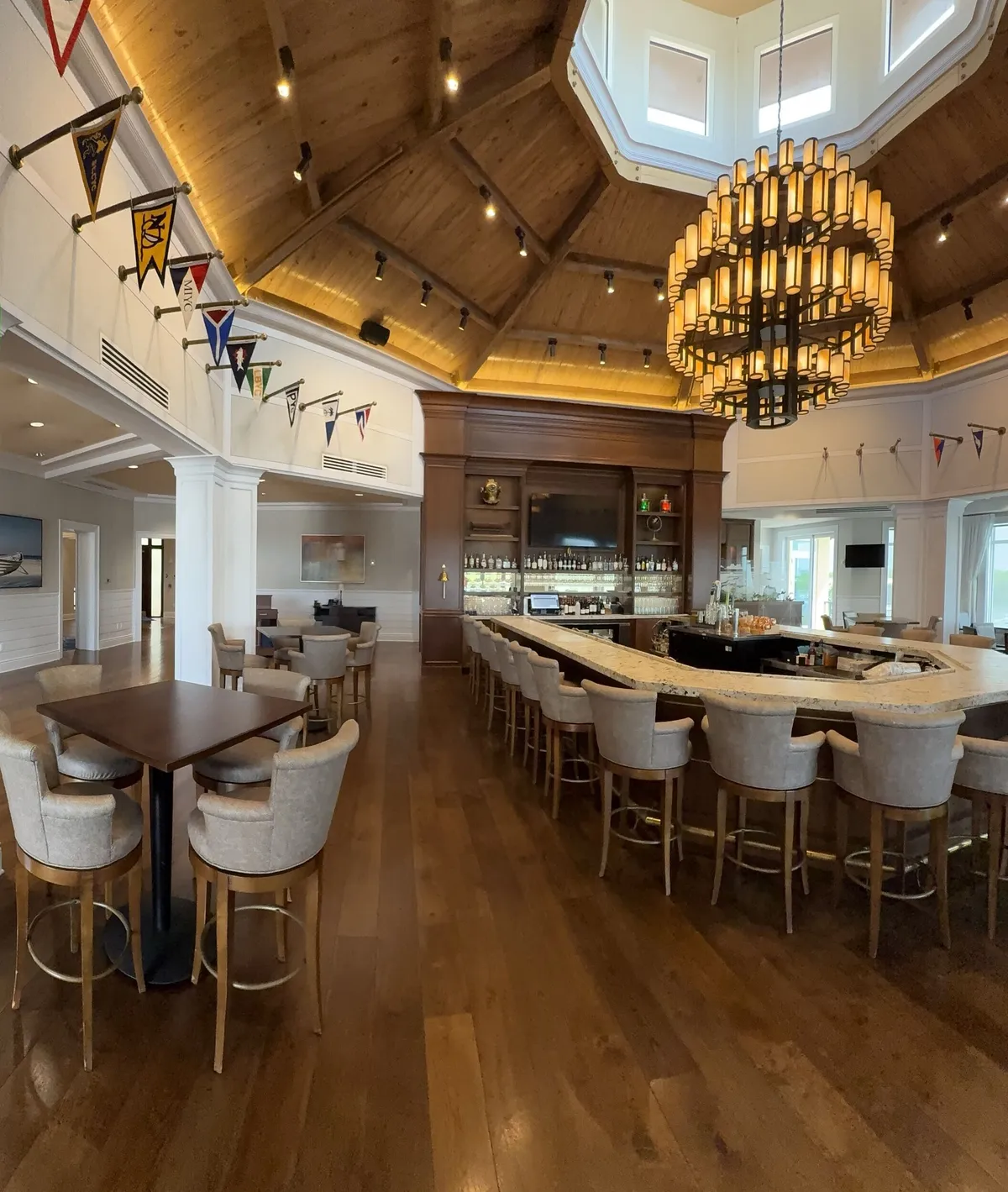 Pelican Isles Yacht Club bar with chandelier after interior repainting