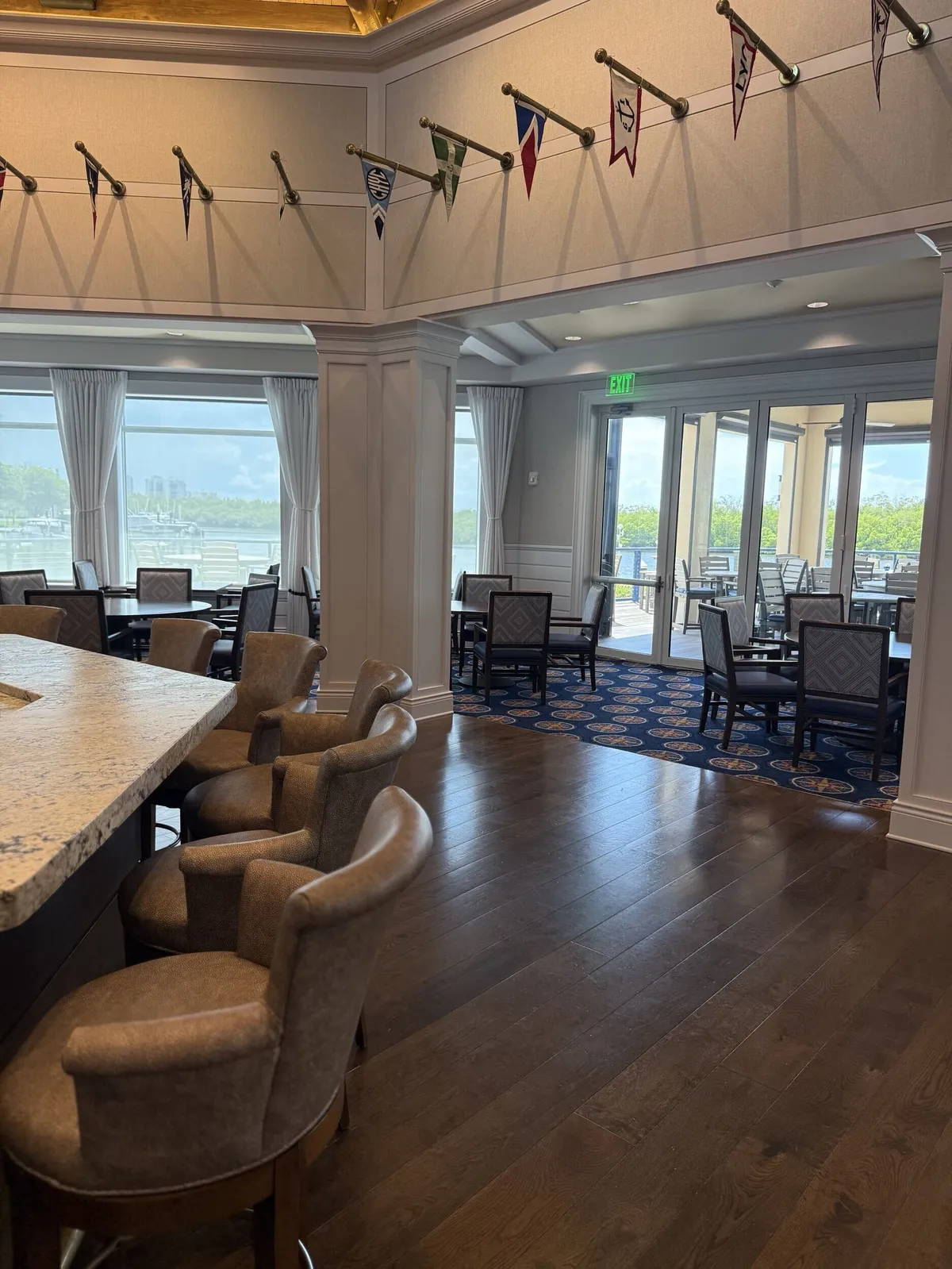 Repainted bar lounge seating and windows at Pelican Isles Yacht Club