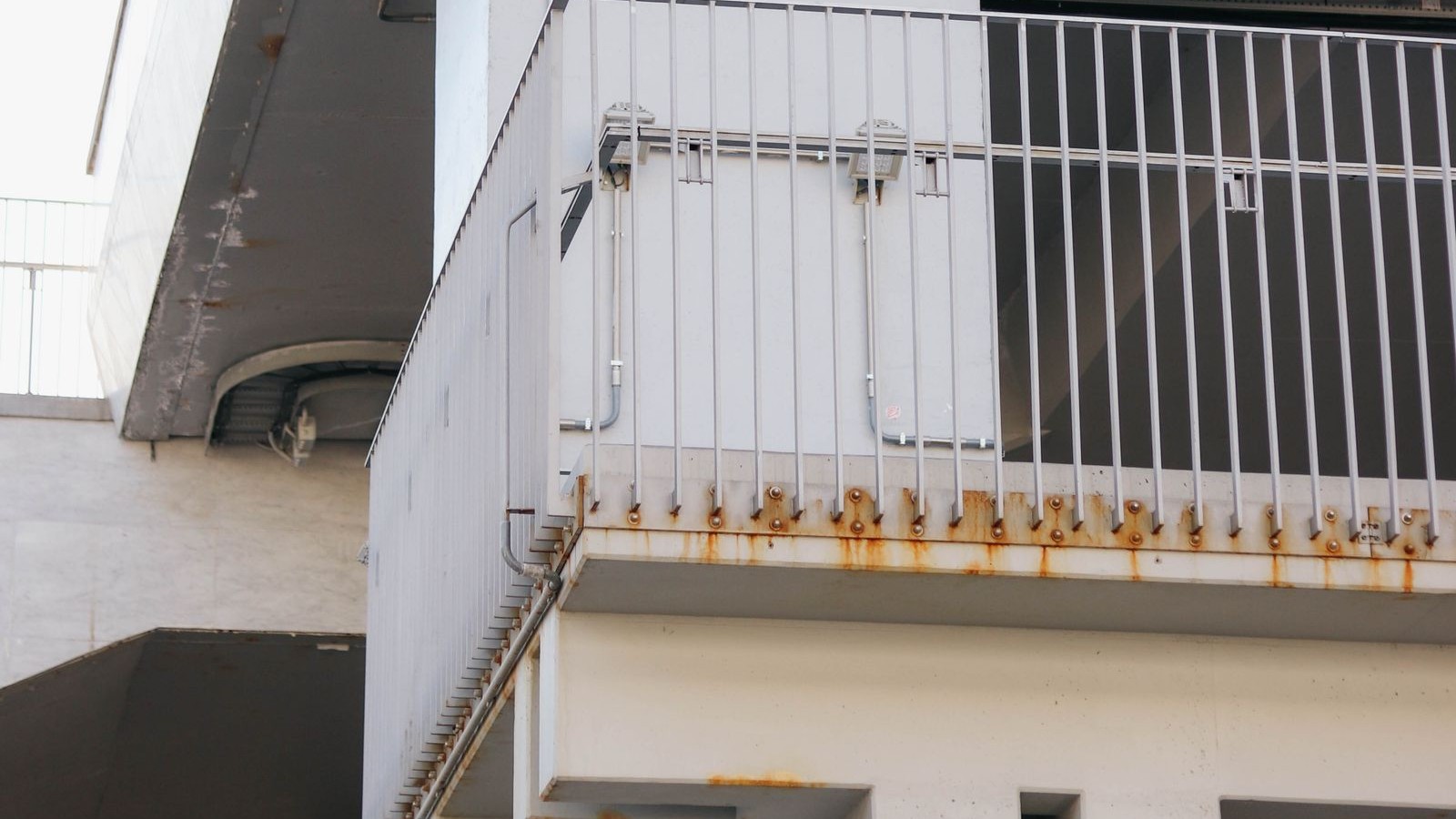 Rusting Railing Posts on Your Lanai: What Corroded Embeds Mean for the Concrete Around Them