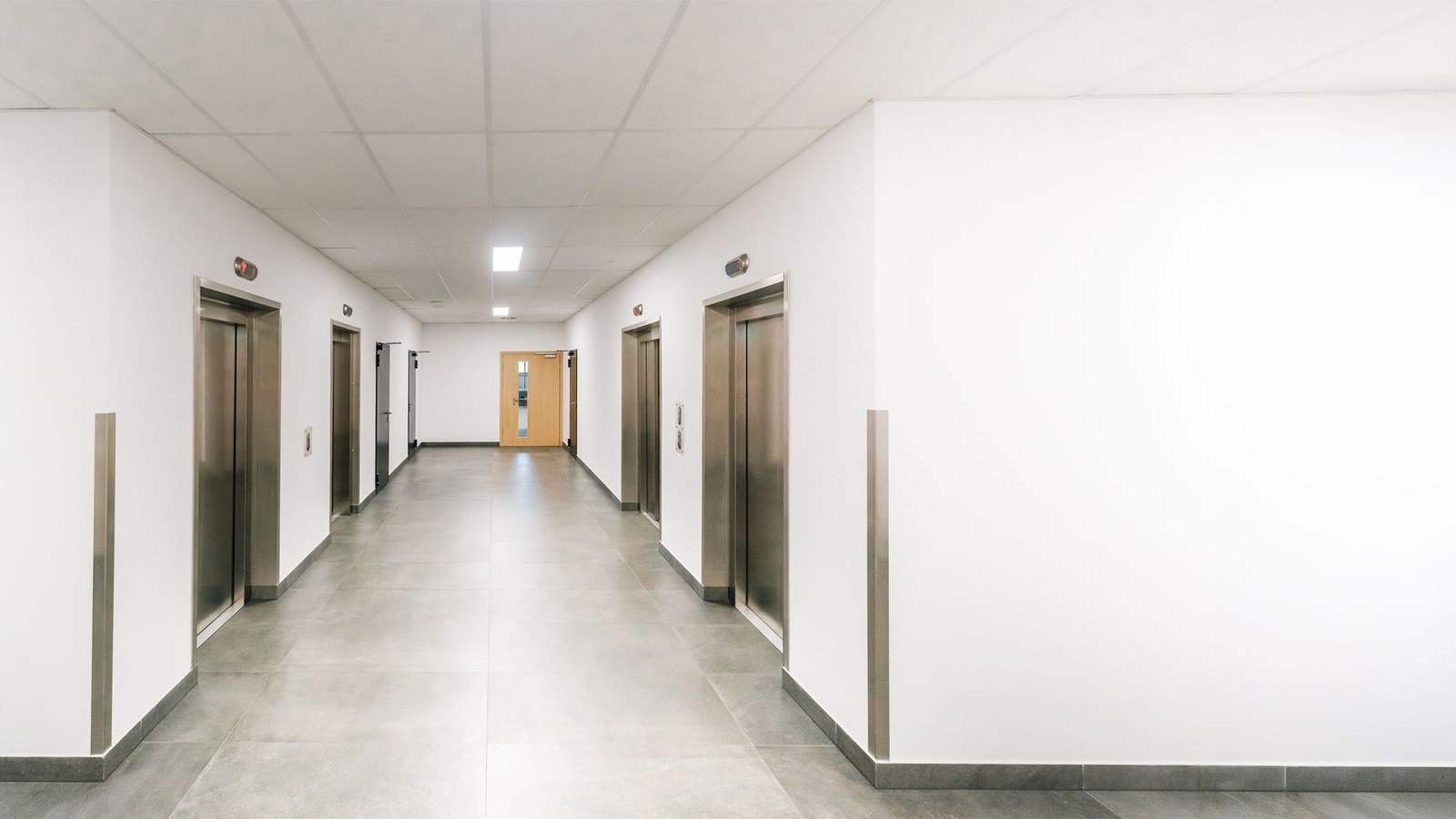 Elevator doors along a corridor in a commercial building