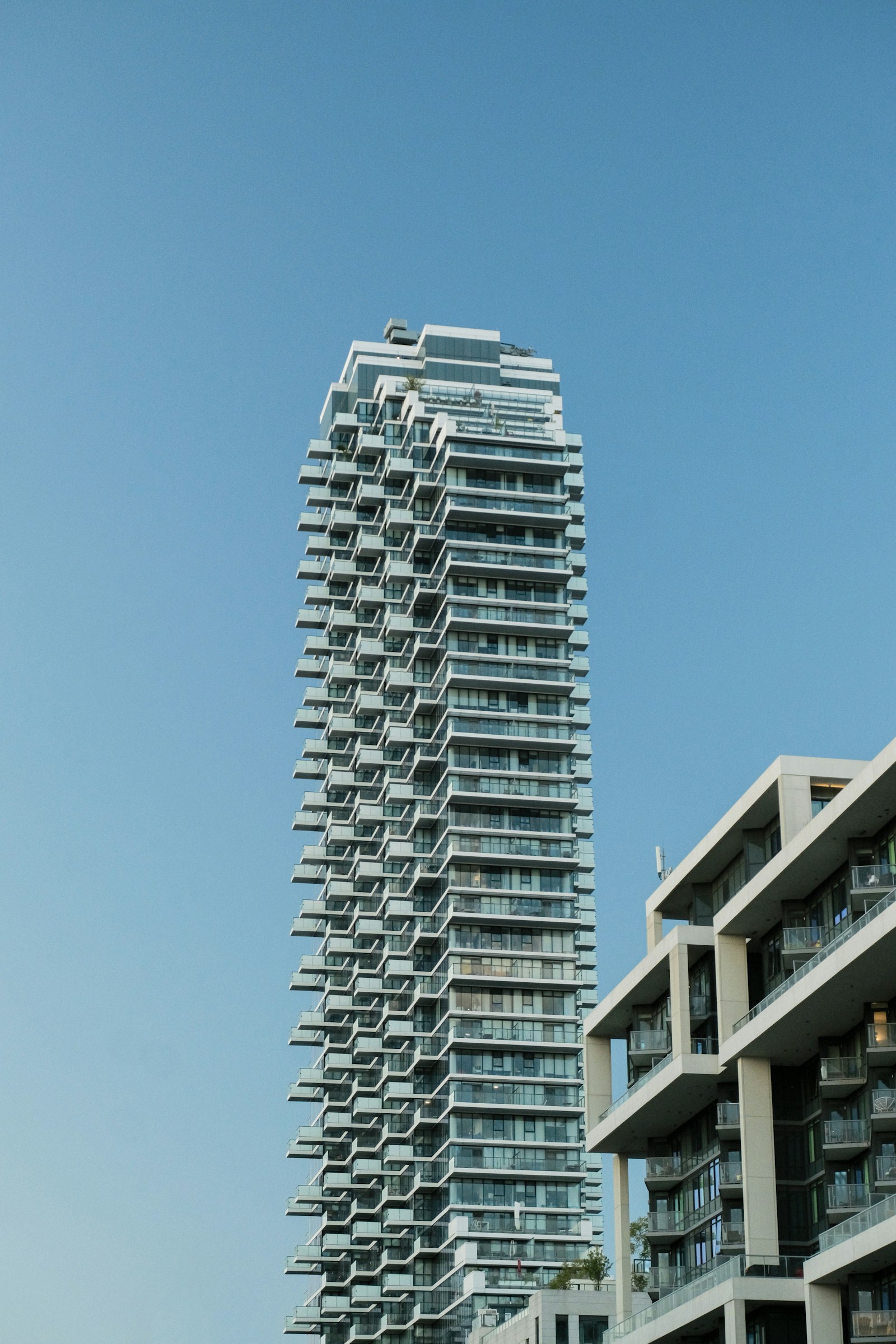 Choosing a Coating System for a Collier County High-Rise: Silicone, Elastomeric, or Acrylic — and What the Warranty Actually Promises