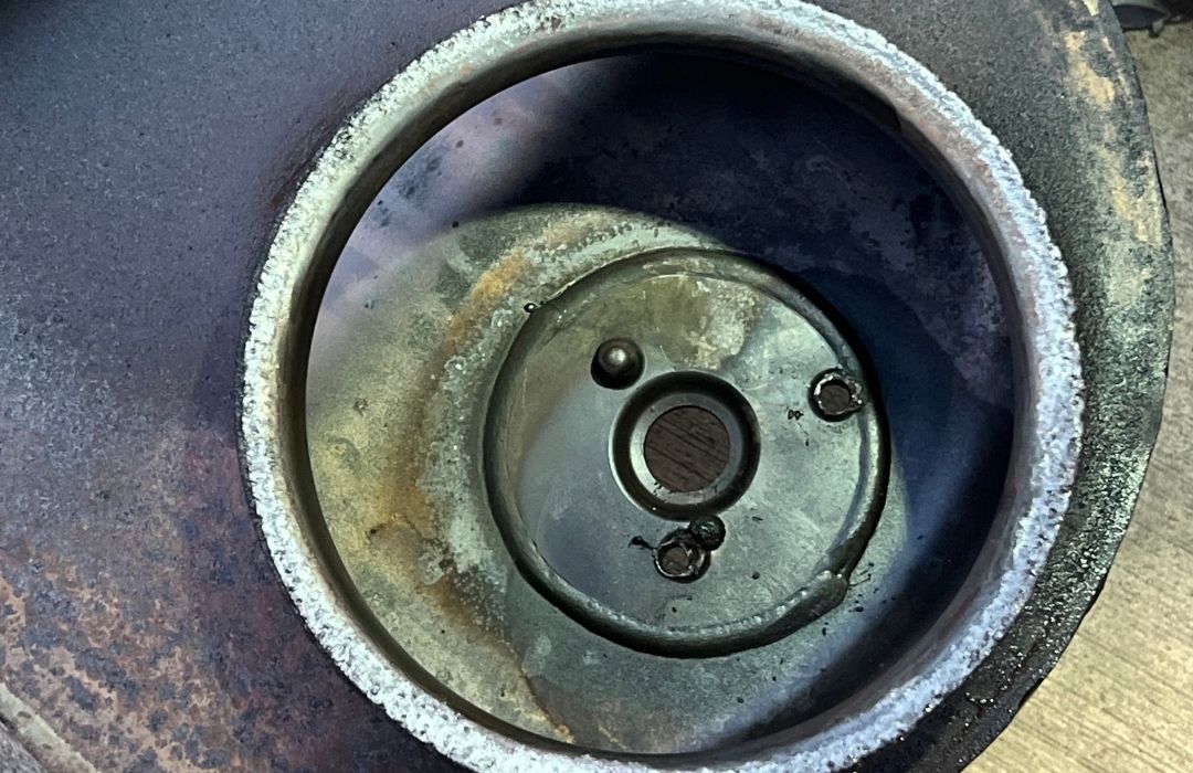 Close-up of a truck DEF system component during DEF repair