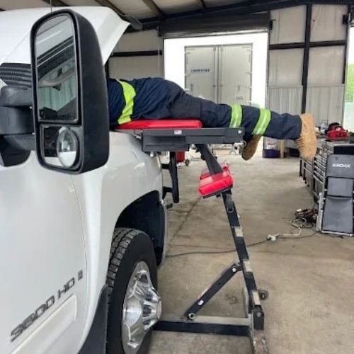Pickup truck engine repair using an over-fender work platform