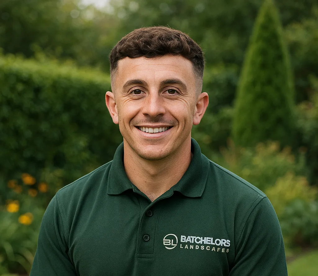 Lewis, expert landscaper in mansfield, wearing Batchelors Landscape's logo on his  lshirt
