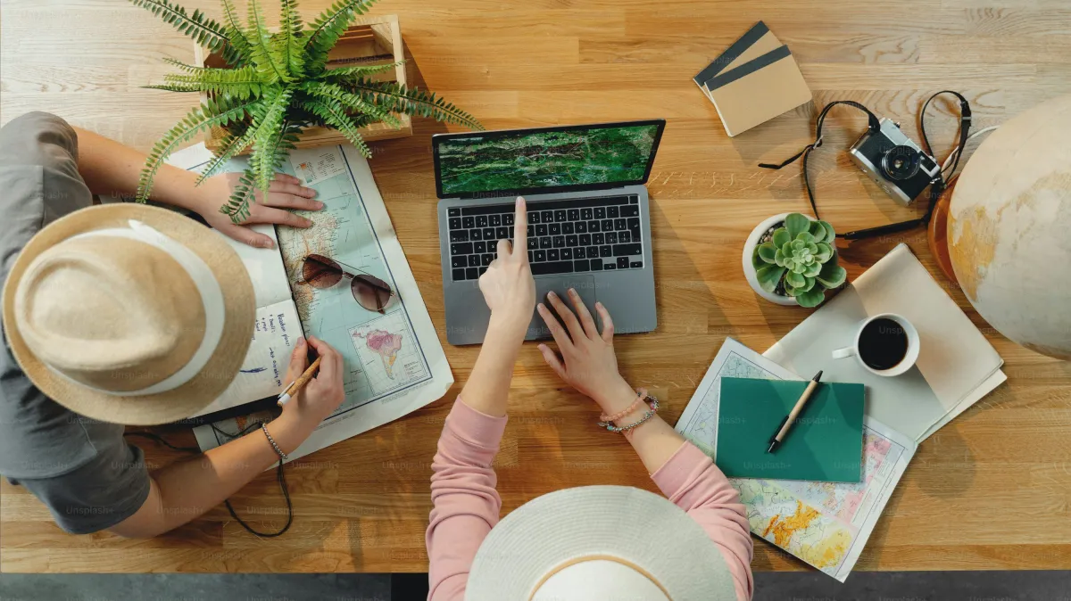 woman in white long sleeve shirt using black laptop computer