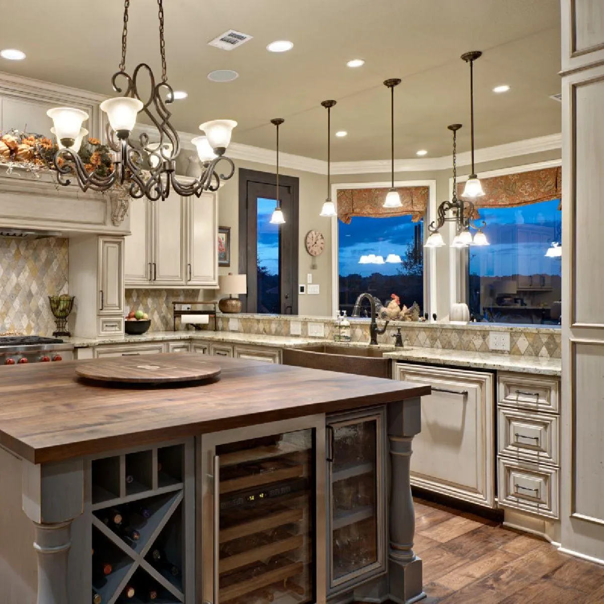Modern white kitchen with island seating and red bar stools