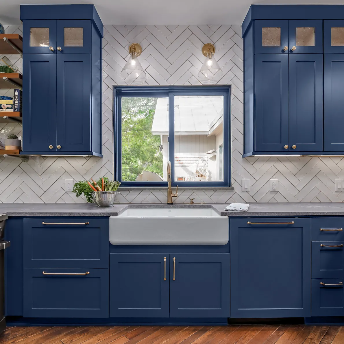 Modern white kitchen with island seating and red bar stools