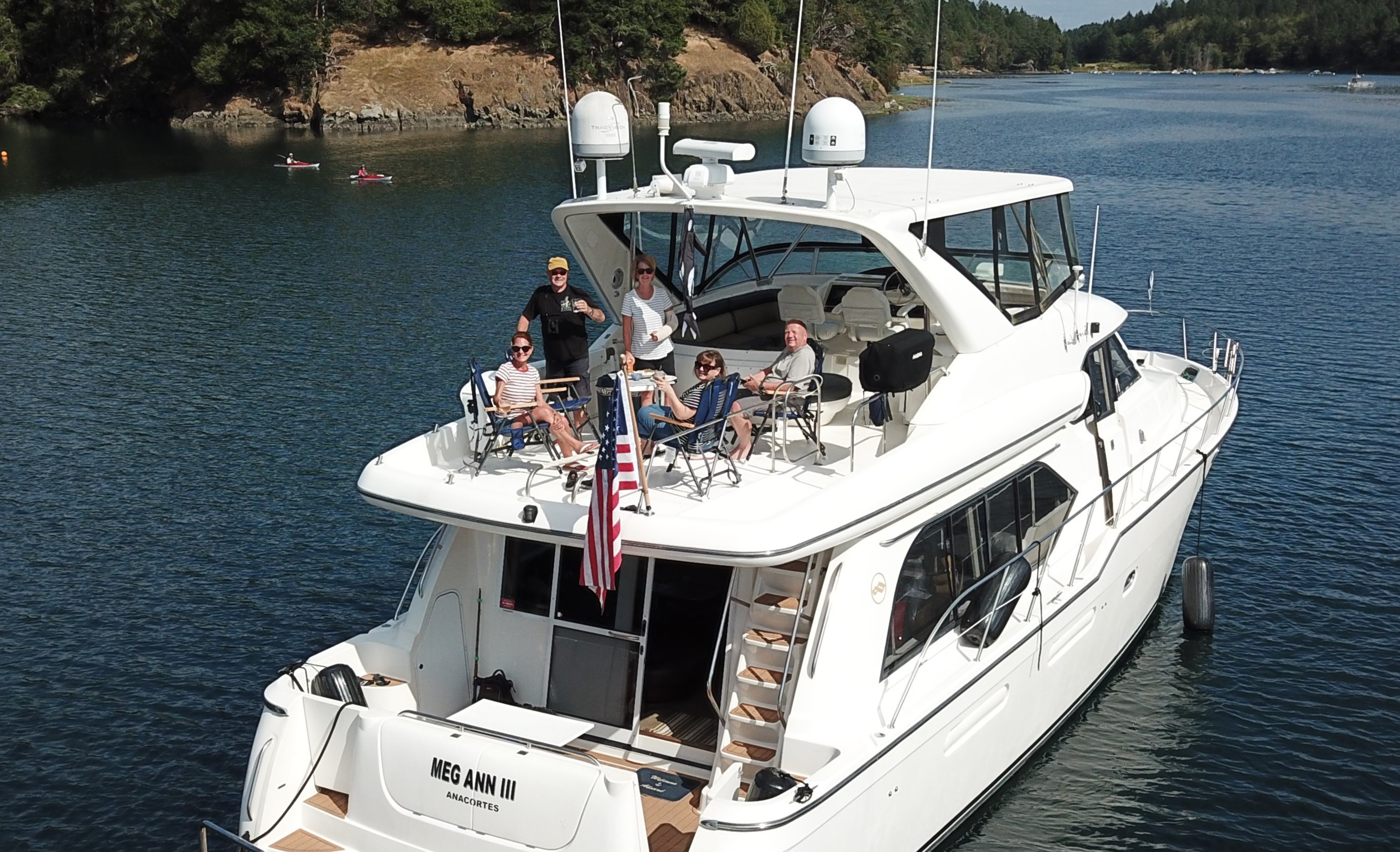 A large boat, calm waters and distant islands creating a peaceful reminder to slow down, travel lighter, and embrace life's simpler moments.