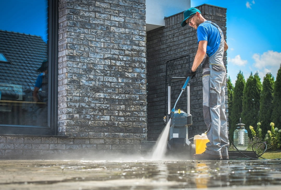 pressure washer cleaning outside cement