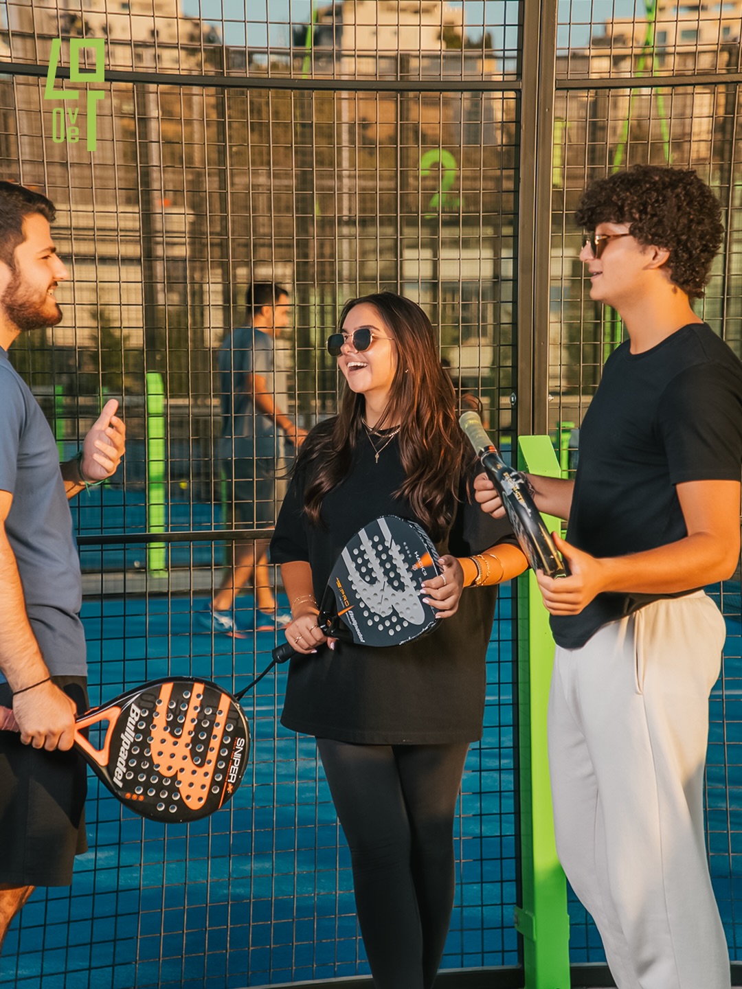 Friends playing padel and enjoying coffee at 40 Love Padel Club & Cafe