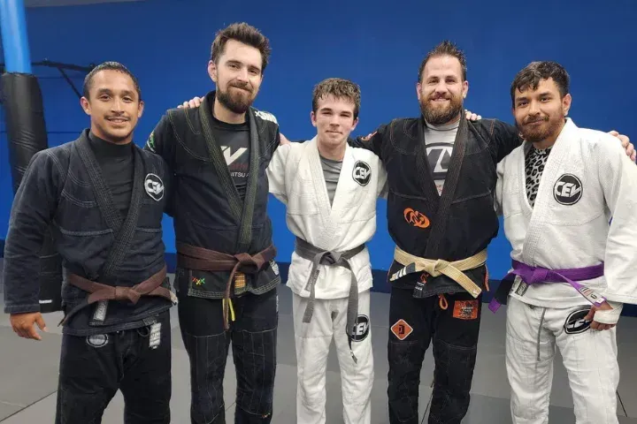 Teens and Adults practicing Jiu Jitsu