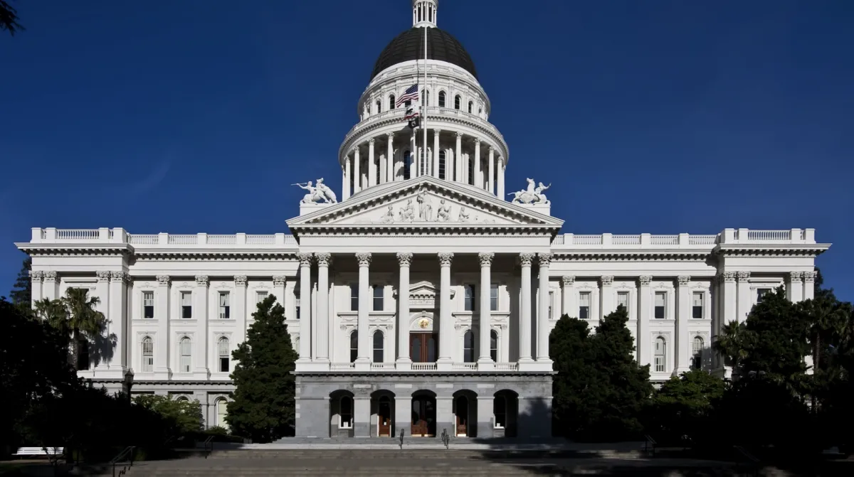 California State Capitol building in Sacramento, featuring the historic white dome and neoclassical architecture, where California lawmakers debate and pass legislation.