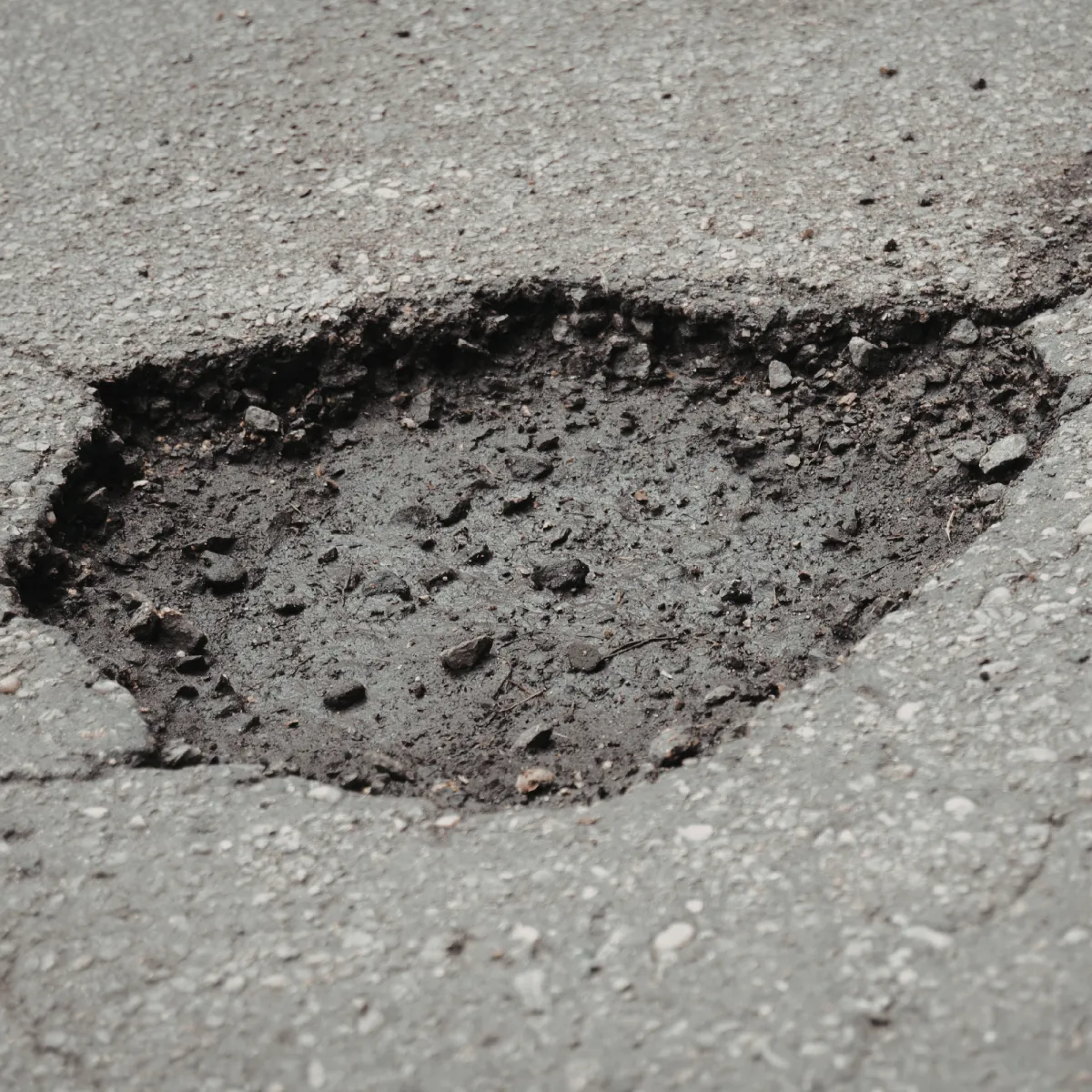 pothole on road in London, Ontario