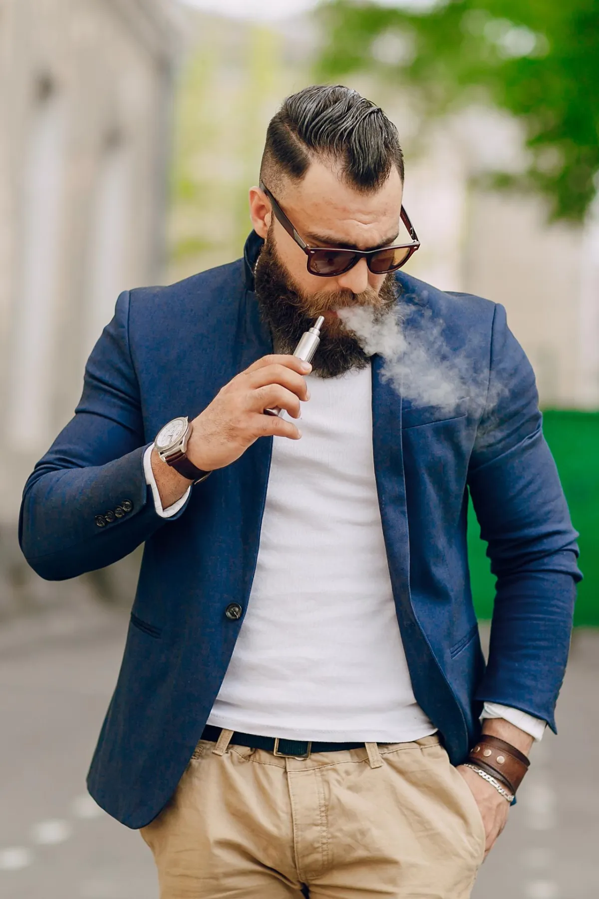 Man Smoking E-Cigarette Outdoor