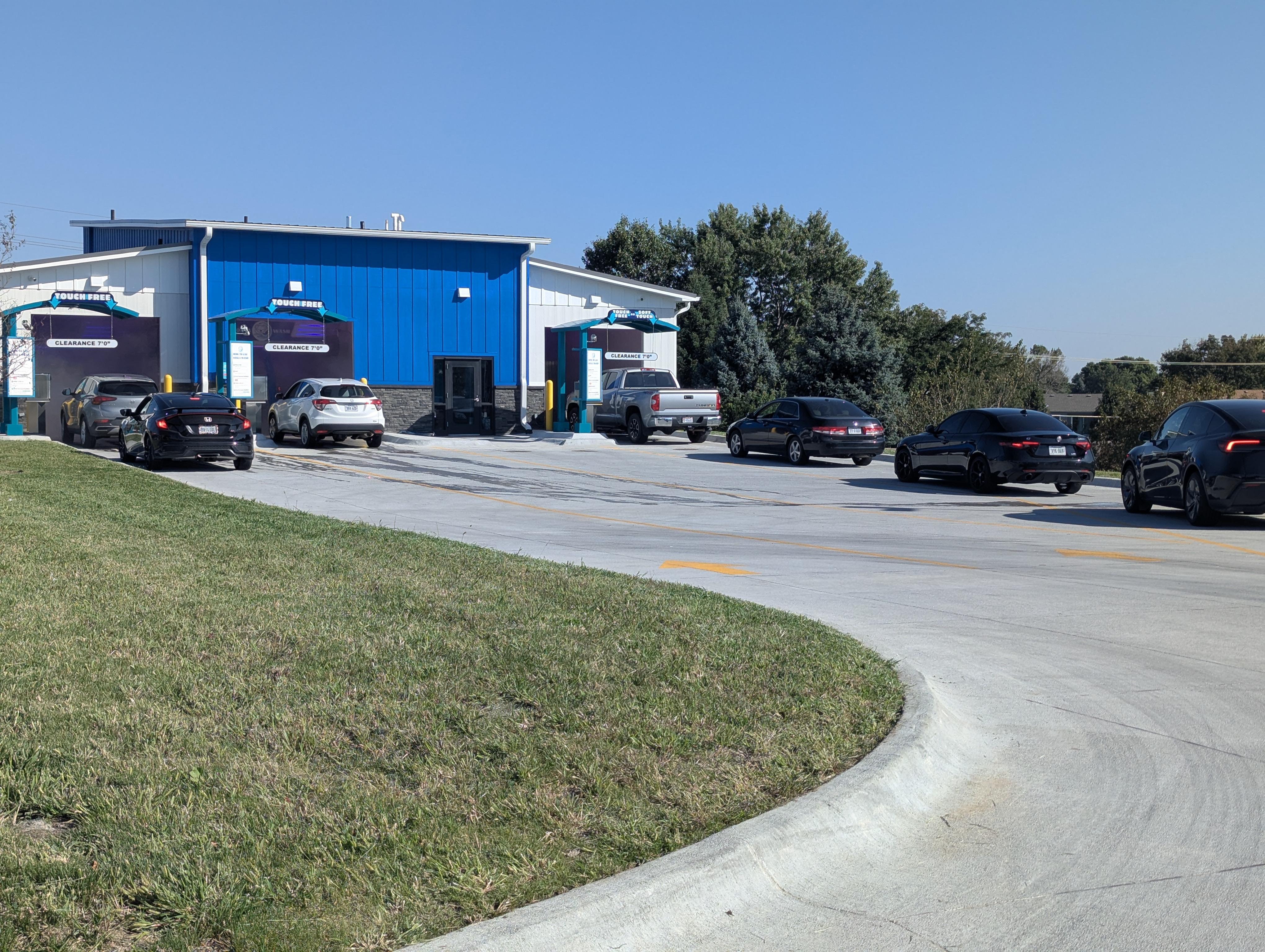 a row of parked cars sitting next to each other