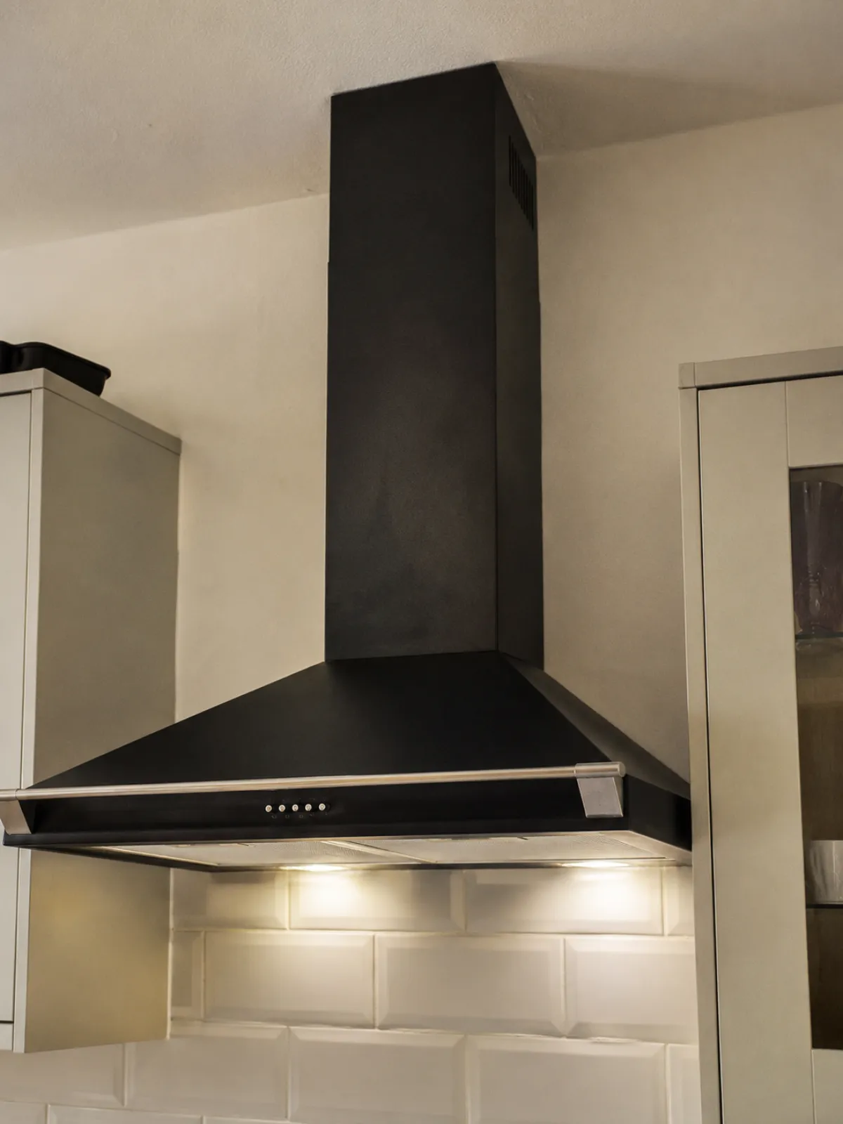 A black kitchen extractor fan that we fitted