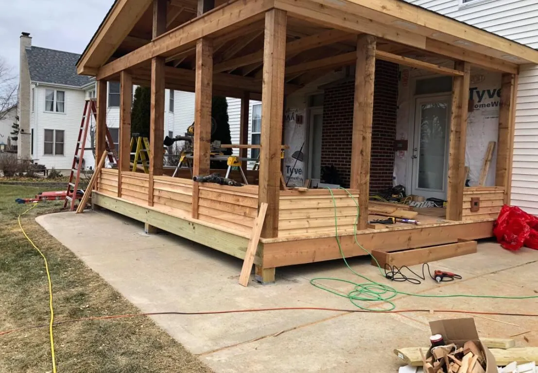 Deck repair crew replacing rotted ledger and flashing in Durham, NC