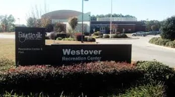 Spacious wood deck with seating zones in Westover, Fayetteville