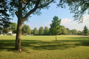Wood deck with classic railing behind Lindley Park home in Greensboro