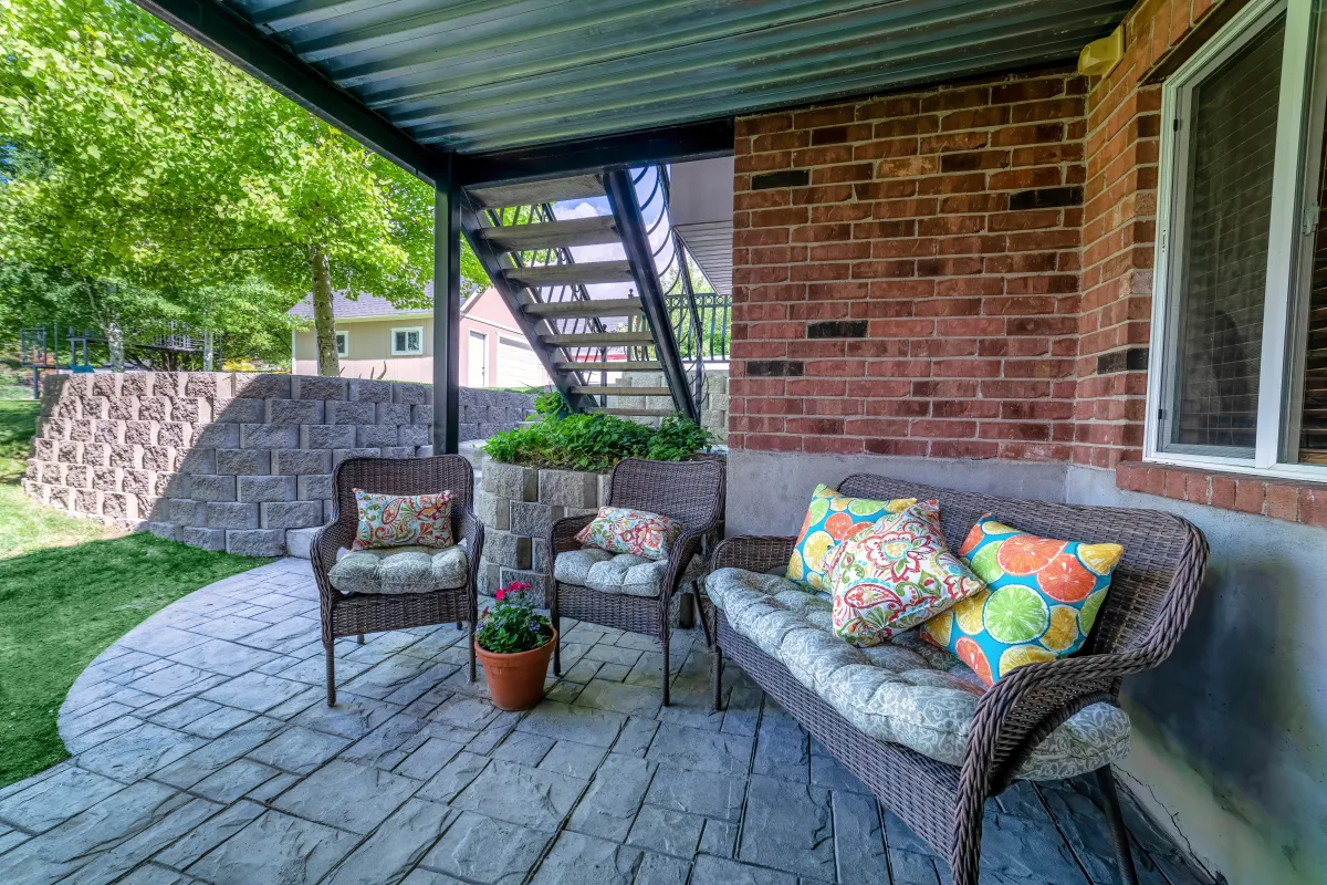 Freestanding patio roof with open gable structure over paver deck in Greensboro, NC